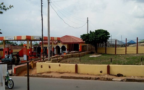 Filling Station sharing a fence with a public primary school in Osogbo