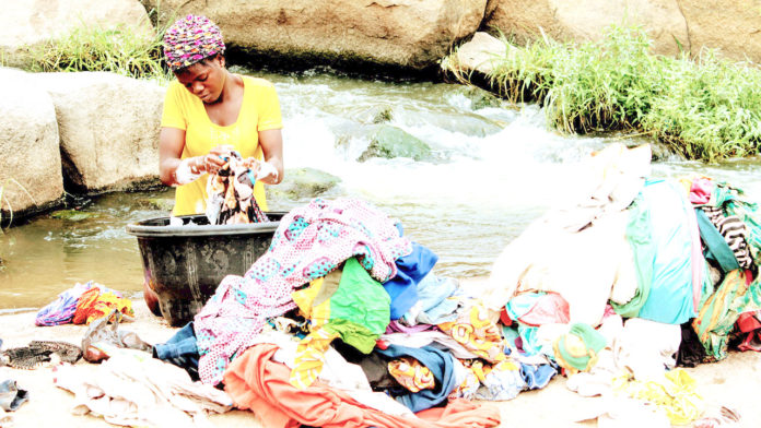 Sekwanya-Joel The young teenager engaged in menial labour in a bid to survive in Gosa, FCT… Photo: Lucy Ladi Ateko